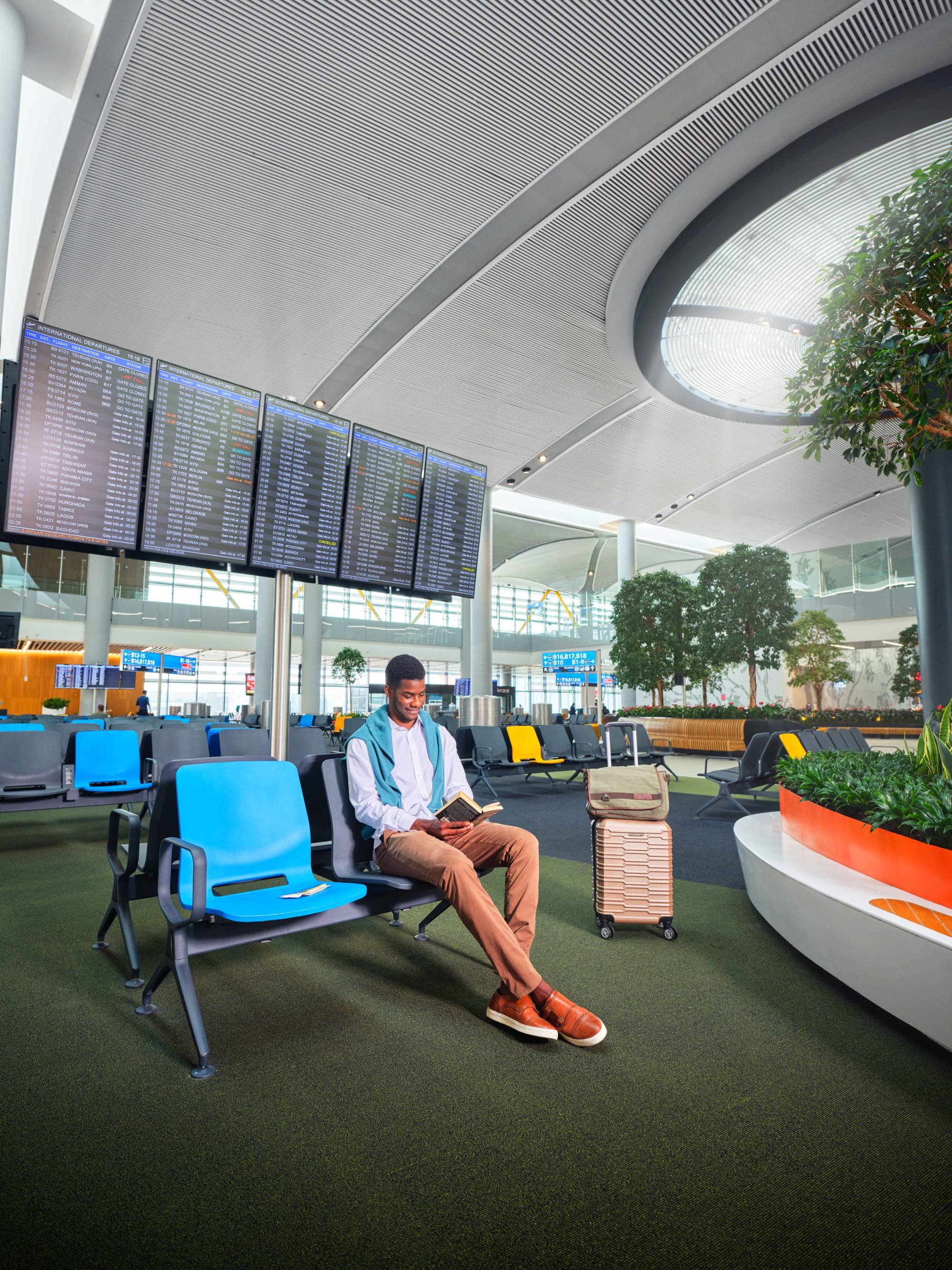 passenger reading books in waiting area