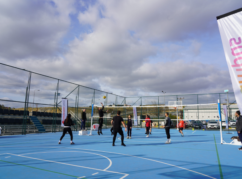 iga employees playing volleyball