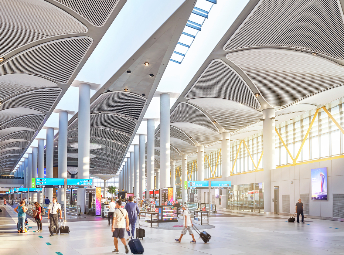 passengers are walking around at istanbul airport terminal