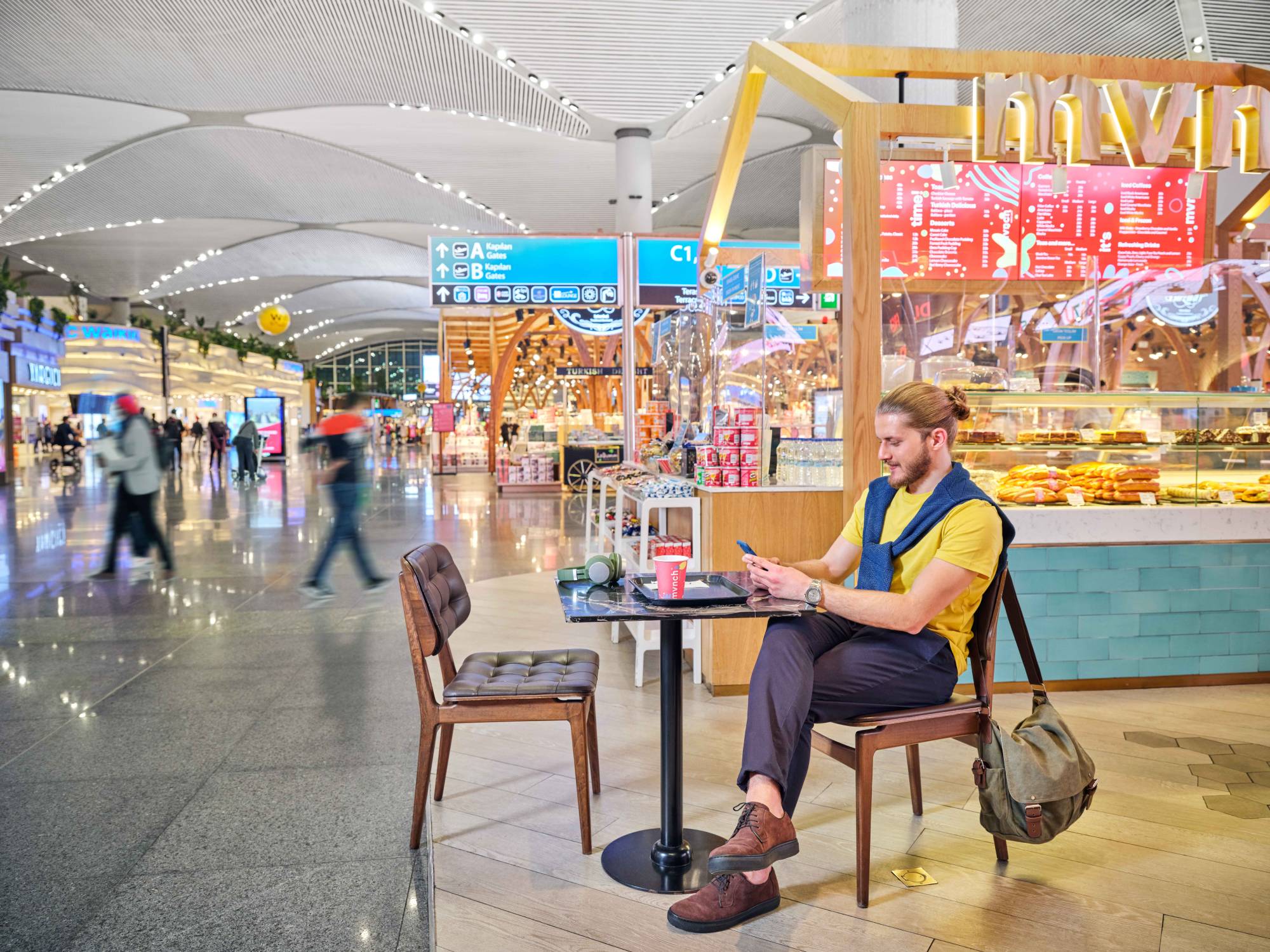 passenger sitting in the airport café